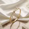 Luxe Gold Knot Bangle with Pearl & Crystal Details